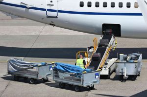 Loose,Luggage,Being,Loaded,Into,Narrow,Body,Aircraft