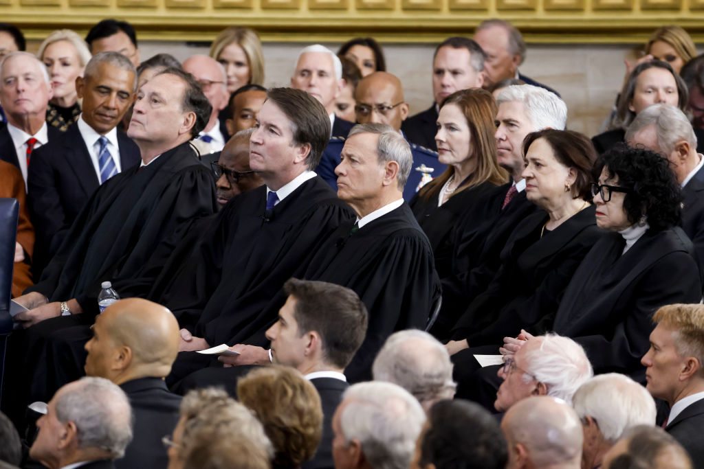Members of the United States Supreme Court listen as US President Donald Trump (L) delivers remarks after being sworn in as the 47th president of the United States in an inauguration ceremony in the Rotunda of the United States Capitol on January 20, 2025 in Washington, DC.