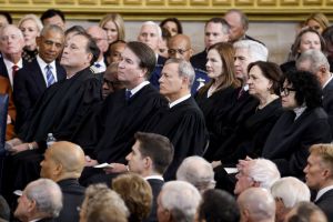 Members of the United States Supreme Court listen as US President Donald Trump (L) delivers remarks after being sworn in as the 47th president of the United States in an inauguration ceremony in the Rotunda of the United States Capitol on January 20, 2025 in Washington, DC.