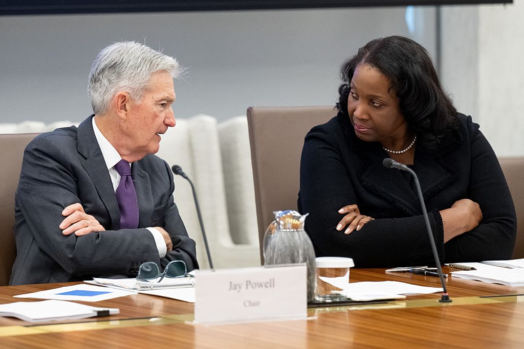 Chairman of the US Federal Reserve Jerome Powell speaks with Lisa Cook, member of the Board of Governors of the Federal Reserve, as he chairs a Federal Reserve Board open meeting discussing proposed revisions to the board's supplementary leverage ratio standards at the Federal Reserve Board building in Washington, DC, on June 25, 2025.