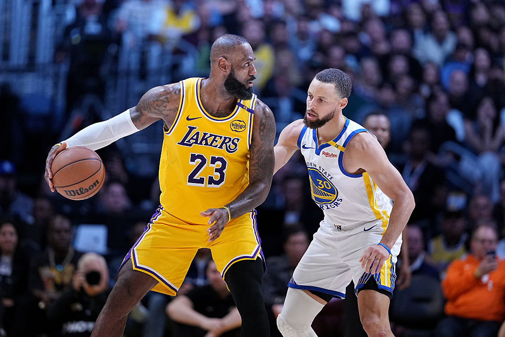 LeBron James #23 of the Los Angeles Lakers controls the ball against Stephen Curry #30 of the Golden State Warriors during the second half of a game at Crypto.com Arena on April 3, 2025, in Los Angeles, California.