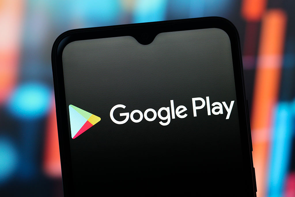 In this photo illustration, the Google Play Store logo is seen displayed on a smartphone screen.